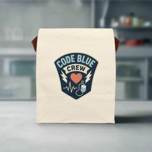 Canvas nurse lunch bag with a bold “Code Blue Crew” badge design featuring a red heart, IV bag, and EKG line. A fun and functional gift for ER nurses, ICU teams, and first responders.

