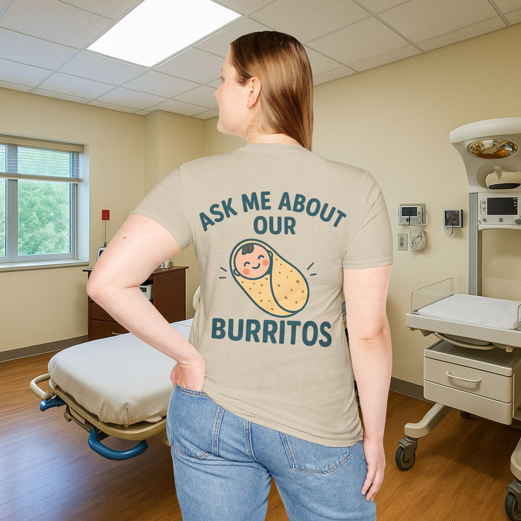 Cute and quirky NICU nurse apparel with baby burrito design, shown on a white shirt in a hospital room setting — multiple color options available.